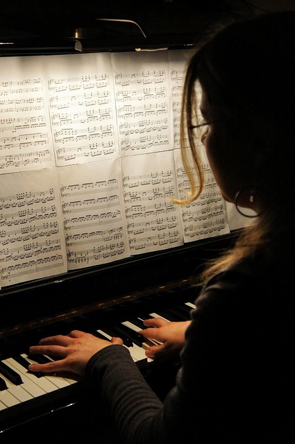 piano player practicing intermediate repertoire with expressive hand movement